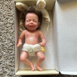 Adorable Reborn Baby Doll with Brown Hair and Cream Outfit